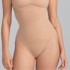 compression sculpts your midsection, boning prevents roll-down, and thong bottom
